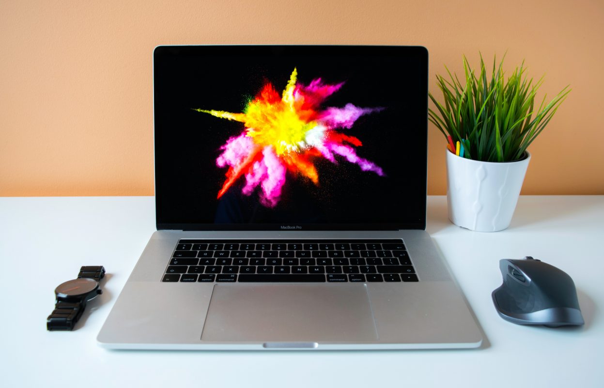 MacBook Pro showing purple illustration